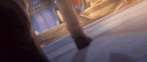 a person is walking down a sidewalk in a video game .