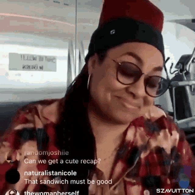 a woman wearing sunglasses and a hat is smiling and looking at the camera