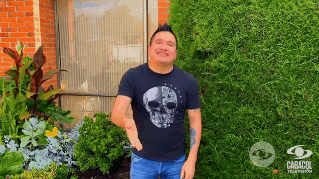 a man in a black shirt with a skull on it