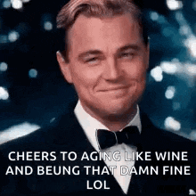 leonardo dicaprio is wearing a tuxedo and bow tie and making a funny face .