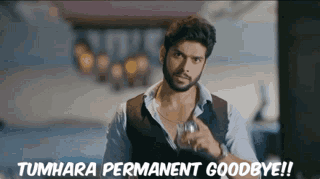 a man holding a glass with the words tumhara permanent goodbye