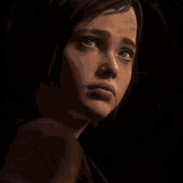 a close up of a woman 's face with a sad look on her face