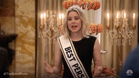 a woman is wearing a sash that says `` best person '' and a tiara .