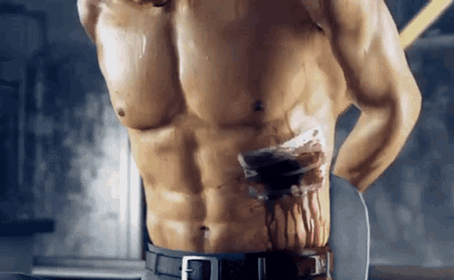 a statue of a shirtless man with blood dripping from his chest