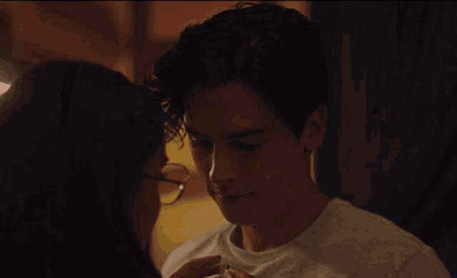 a man and a woman are looking at each other