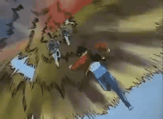 a man in a red shirt and blue jeans is flying through the air