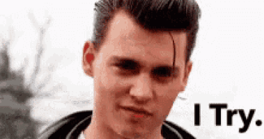 a close up of a man 's face with the words `` i try '' written on the bottom .