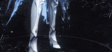 a person is standing in a dark room with a blue light behind them