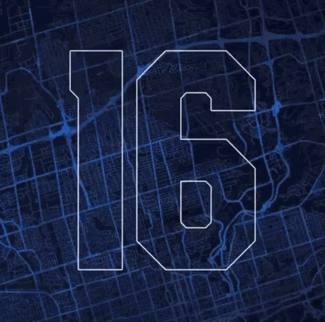 a man in a toronto maple leafs jersey stands in front of a blue box