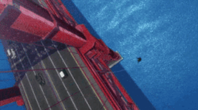 a large aircraft carrier with a blue light coming out of the top