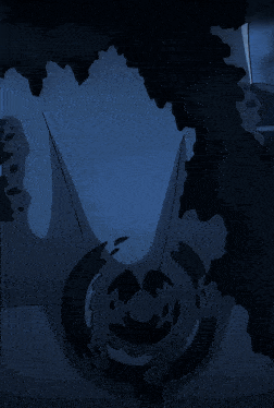 a blurry picture of a man and a woman standing next to each other in a dark room