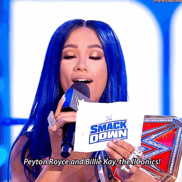 a woman is holding a piece of paper that says smack down