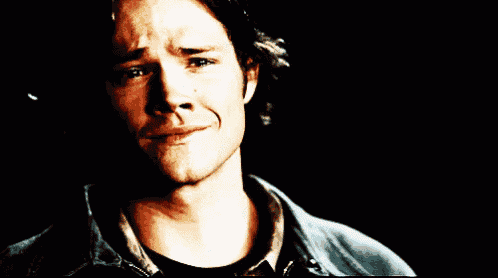 a close up of a man 's face with tears running down his face