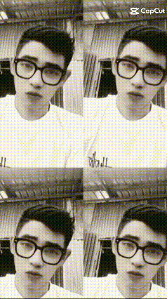 a black and white photo of a man wearing glasses and a white shirt