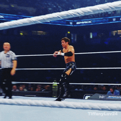 a man in a wrestling ring with the word smack on the wall