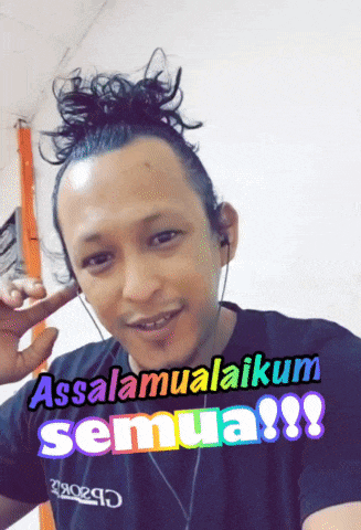 a man with a bun on his head is wearing headphones and says assalamualaikum semua