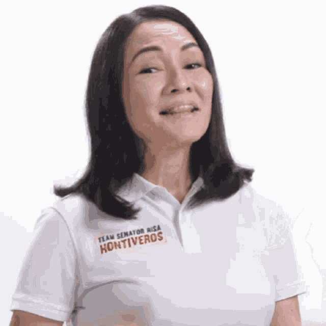 a woman is wearing a white polo shirt with the word hontiveros on it .