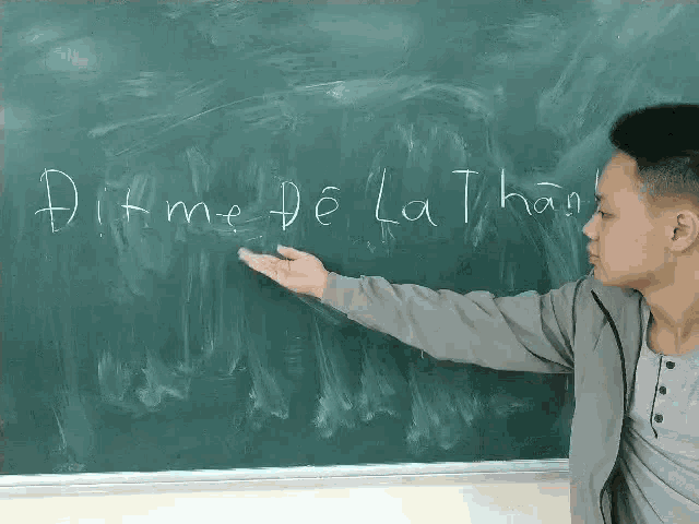 a man is pointing at a blackboard with the word ditme written on it