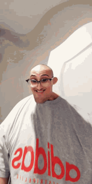 a bald man wearing glasses and a shirt that says epbibp