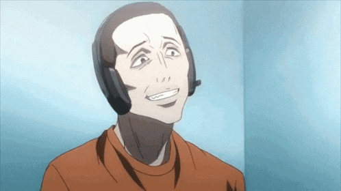 a man wearing headphones and a microphone is smiling in a room .