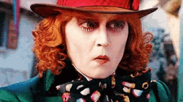 a close up of a person wearing a top hat