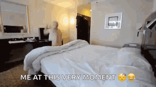 a hotel room with a bed and a basketball hoop on the wall
