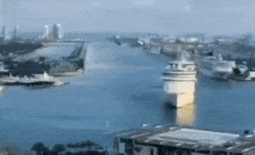 an aerial view of a large body of water with boats in it