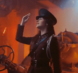 a woman in a military uniform is saluting