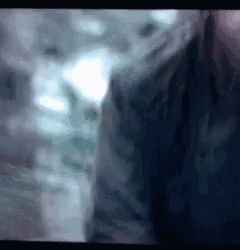 a blurry picture of a person 's face with a blurred background