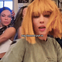 a woman wearing a wig with the words " wig themed put in " above her