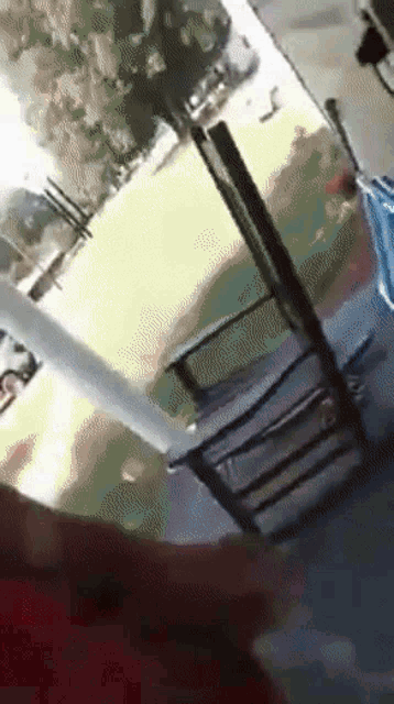 a person is standing in front of a rocking chair