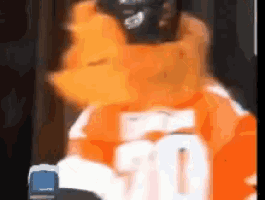 a blurry picture of a person wearing a jersey with the number 20 on it