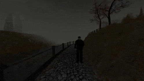 a blurry picture of a person walking down a cobblestone street at night .