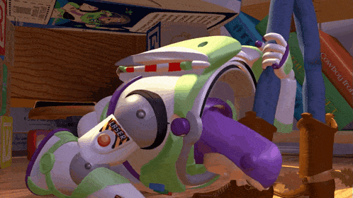 buzz lightyear from toy story is laying on the ground