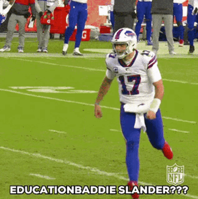 a football player is running on a field with the words `` education baddie slander '' written on the bottom .