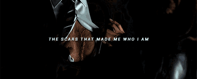 a close up of a woman 's face with blood on it and the words `` the scars that made me who i am ''