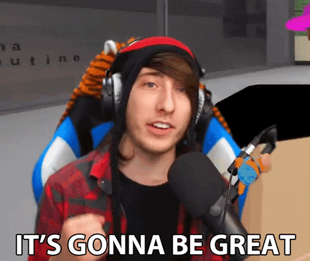 a man wearing headphones and a hat says " it 's gonna be great "