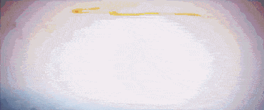 a purple and white background with a few spots of red on it