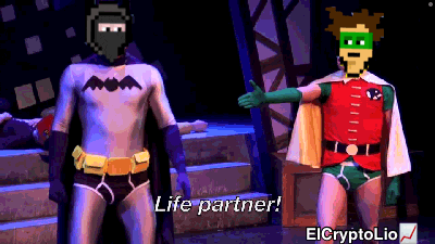 a pixelated batman and robin are standing next to each other with the caption life partner