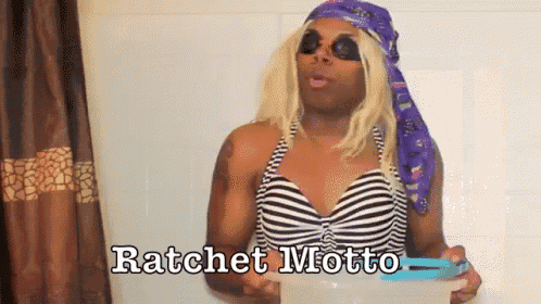 a woman in a bathing suit says ratchet motto in a bathroom