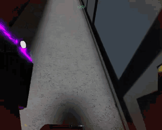 a purple light is shining on a concrete wall with the number 253 visible