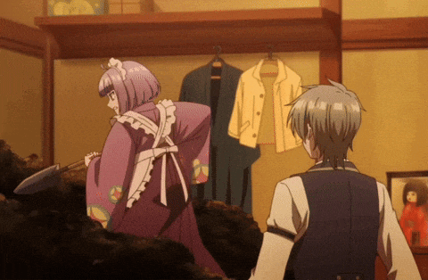 a girl in a maid outfit is standing next to a man in a suit