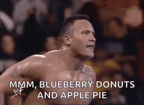 a shirtless wrestler is jumping in the air while talking about blueberry donuts and apple pie