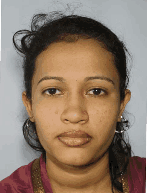 a close up of a woman 's face with her eyes closed