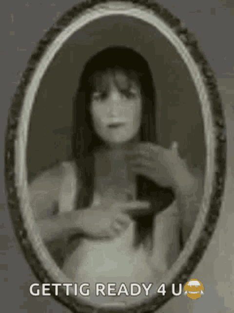 a black and white photo of a woman in a picture frame .