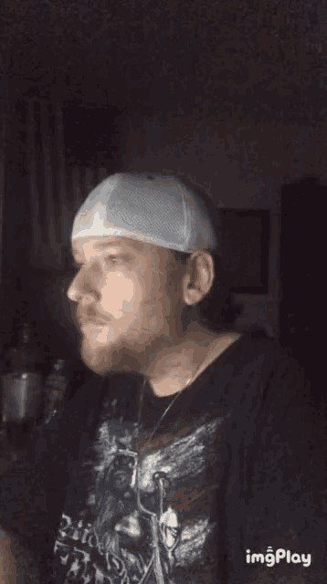 a man with a beard wearing a hat and a shirt that says " freedom "
