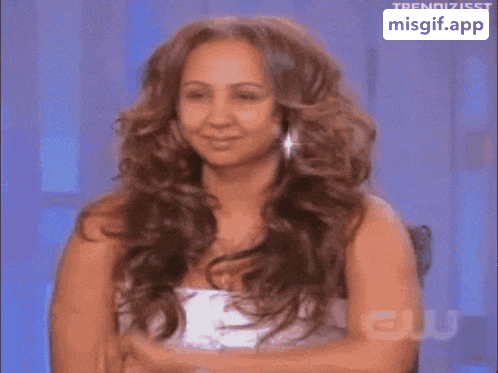 a woman 's face is shown in a gif that says misgif.app on the bottom right