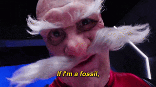 a man with a fake mustache and beard is saying if i 'm a fossil