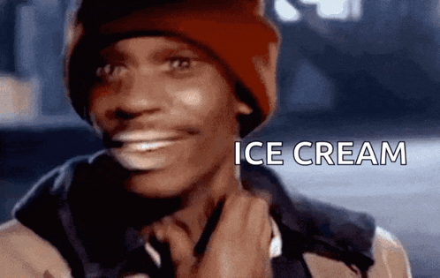 a man wearing a red hat and a jacket is smiling with the words ice cream written above him .