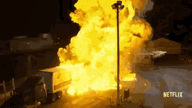 a large explosion in a parking lot with a netflix logo on the bottom